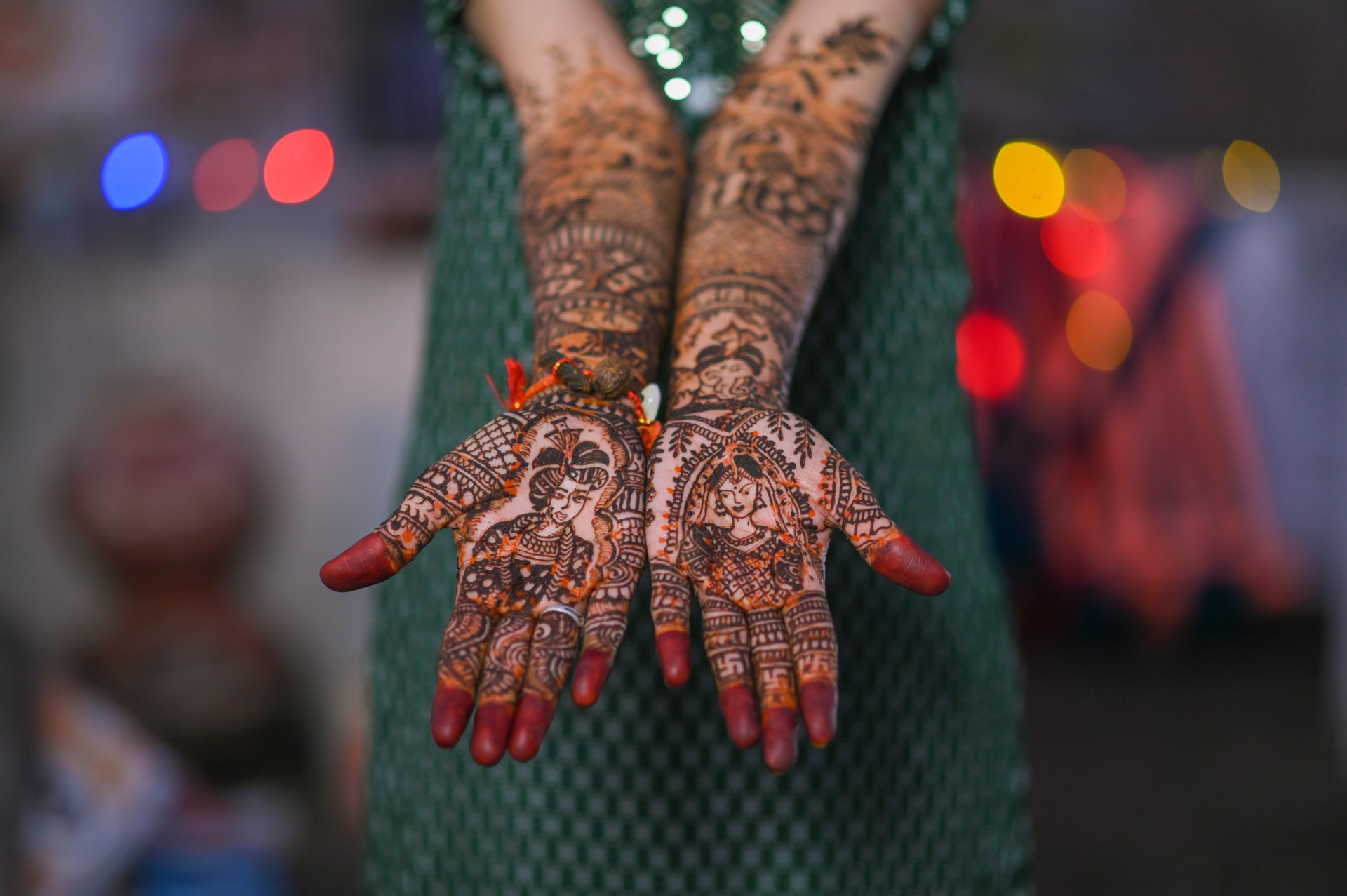 A Beautiful artwork henna on the hand of an Indian bride with herbal heena in wet condition